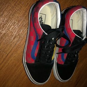 Blue,yellow,red chekerd vans.